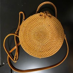 Circular rattan purse with bow